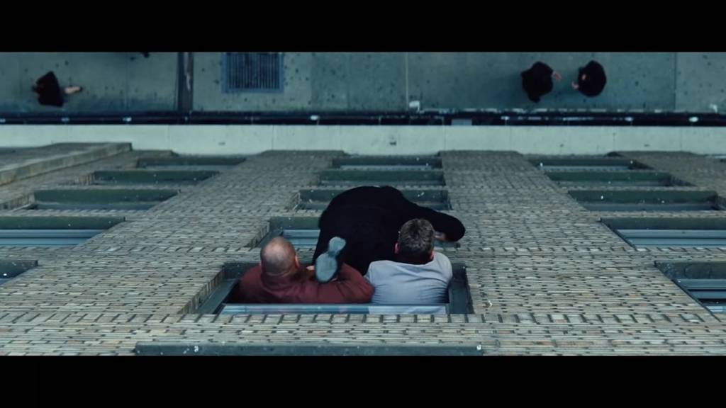 Howard Ratner (Adam Sandler) is dangled out of his window by his creditors. Uncut Gems 