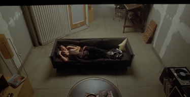 A couple lying on a couch
